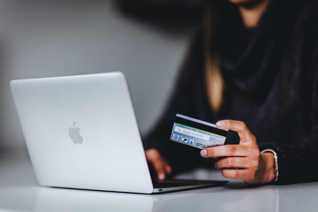 A woman who enters her bank details while shopping at an e-commerce.